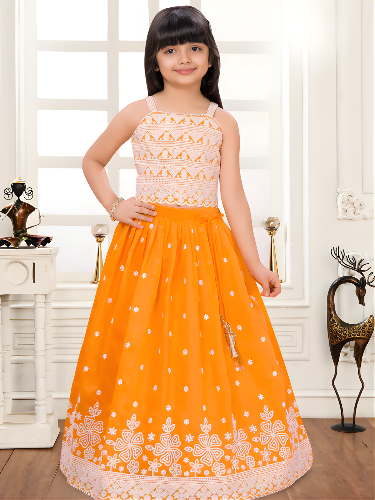 Girls' Tangerine Orange Lehenga Choli with White Threadwork.