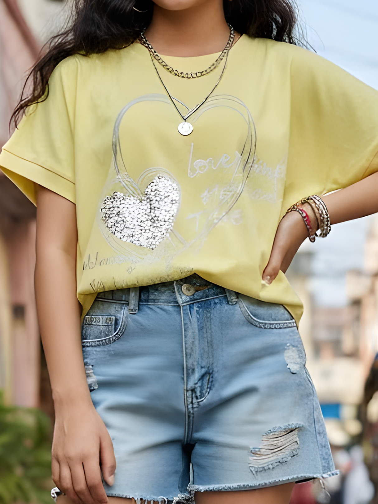 Girls' Radiant Yellow Heart Graphic Top.