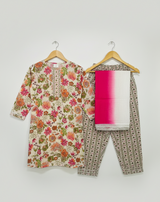 Girls' long-sleeve cream blouse with an embroidered pattern on the chest in maroon, purple, and green thread.