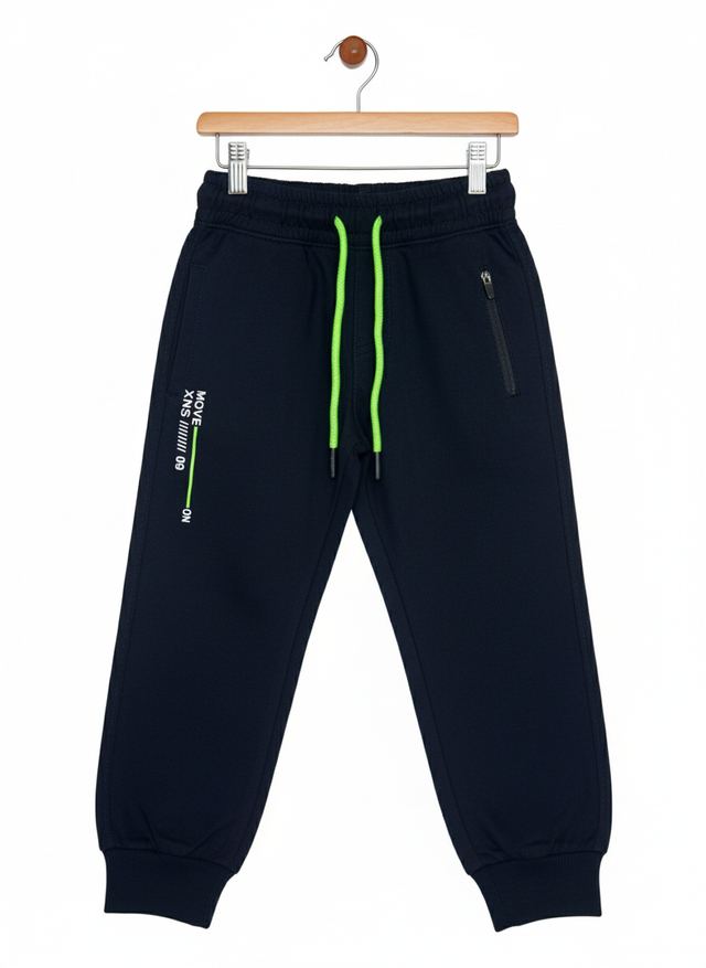 A pair of boys' navy blue fleece jogger track pants with an elastic waist, bright neon green contrast drawstring, ribbed ankle cuffs, and a vertical zippered pocket.
