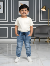 Boys' Mid-Wash Denim Joggers with Elasticated Cuffs and Drawstring Waist.