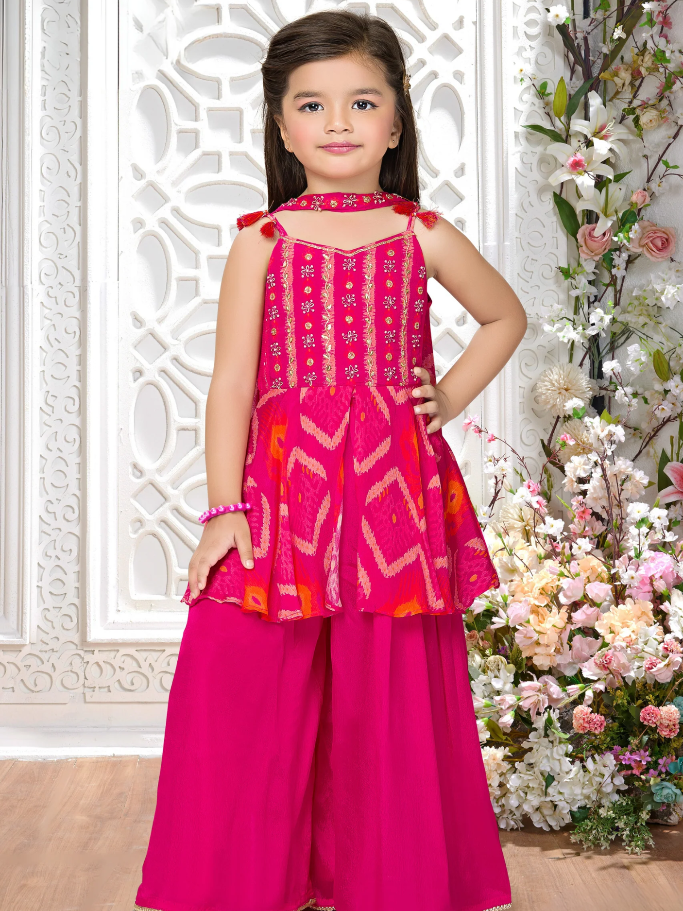 Girls' Vibrant Rani Pink Sharara Suit with Embroidered Peplum Top.
