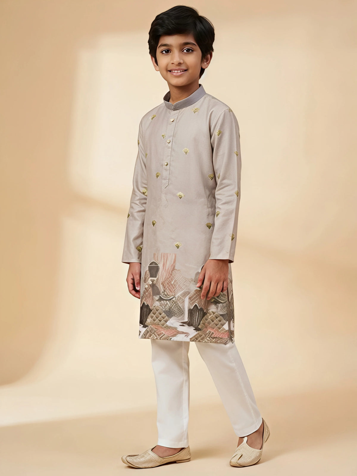 Boys grey kurta pajama set with gold foil prints and landscape border design.