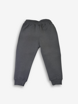 Boys' dark charcoal grey jogger pants with an elastic waist, cuffed ankles, and a visible speckled grey and white rope drawcord.

Export to Sheets