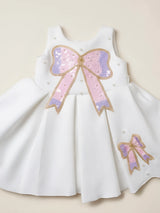 Girls White Sequin Bow Party Wear Frock.