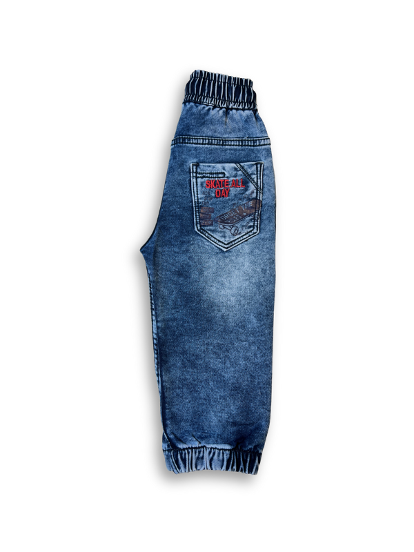 Boys' medium blue wash jogger pants with an elastic waist, white drawstring, embroidered patch on the left thigh, and cuffed ankles.

Export to Sheets