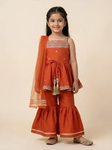 Orange embroidered palazzo set for girls with matching dupatta displayed flat.