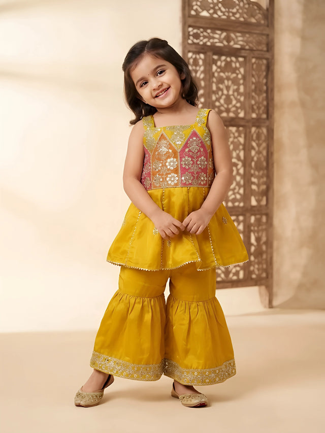 Yellow embroidered sharara set with traditional floral yoke design and sharara pants.