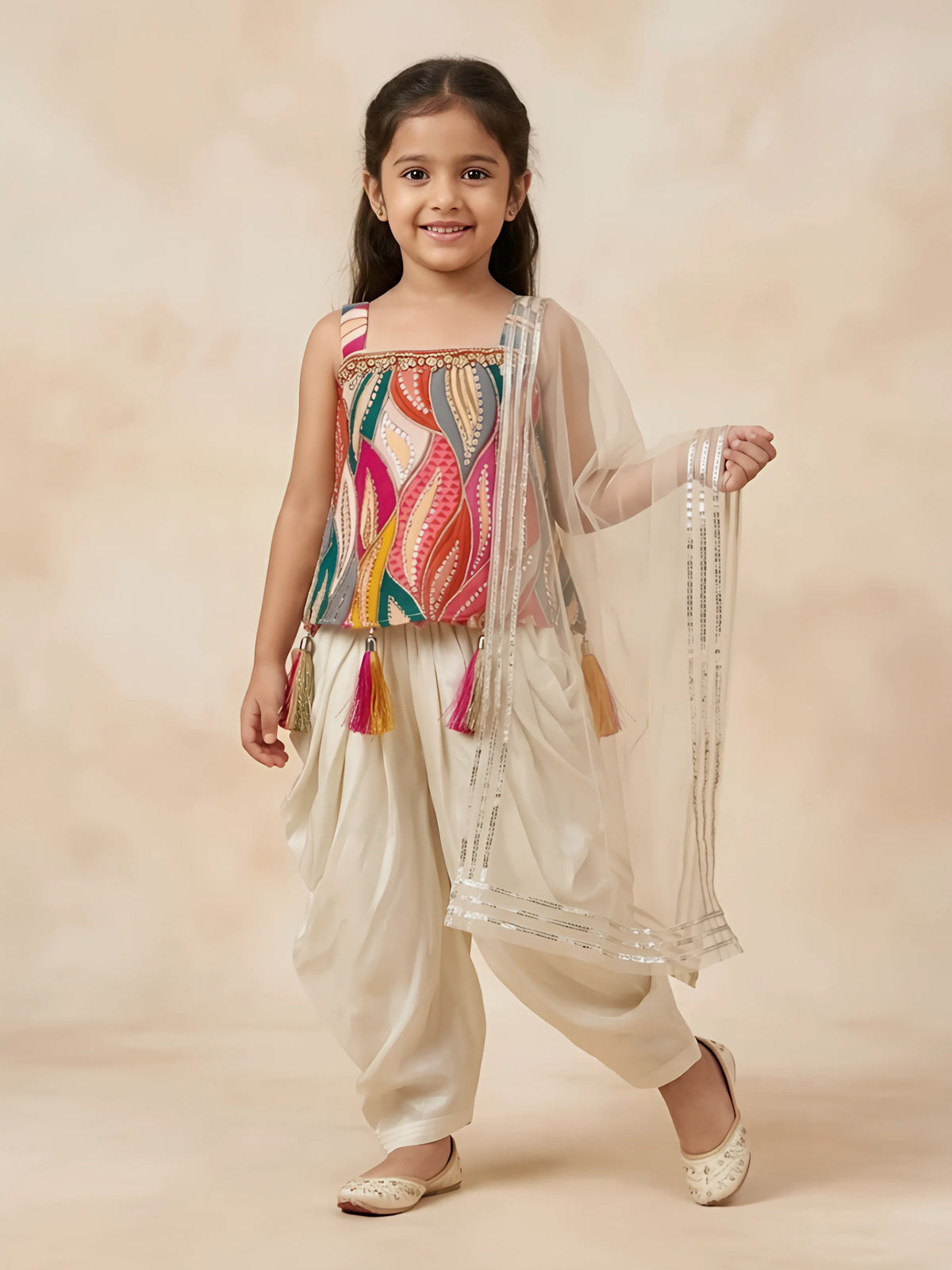 Cream and multicolour leaf print patiala set for girls with matching dupatta displayed on a white background.