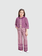 Young girl smiling in a purple and cream two-piece coordinated set, featuring wide-leg trousers in a geometric print and a cropped, striped jacket with three-quarter sleeves