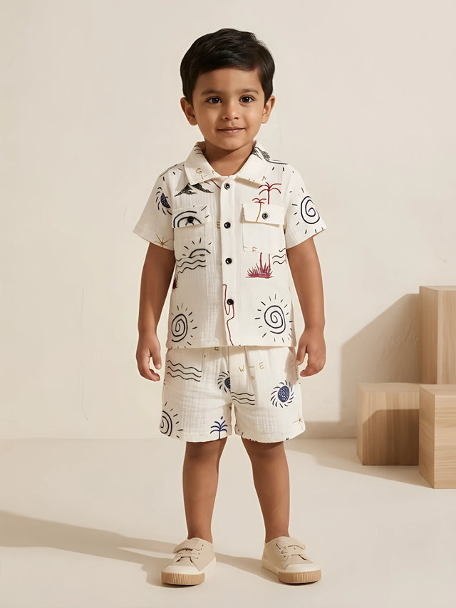 Boys blue graphic printed cotton shirt and shorts coordinate set.