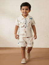 Green doodle printed boys coordinate set with a short-sleeve collared shirt and matching shorts.