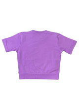 Girls' short-sleeve lavender/purple top with a large central graphic featuring a pink heart, the word 'LOVE' in white sequins, and small yellow hearts.

Export to Sheets