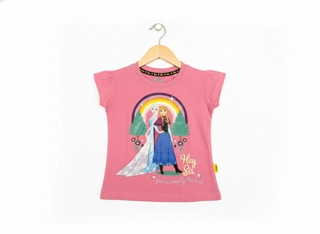 Disney Frozen Anna and Elsa 'Hey Sis, you're simply the best' graphic print with a rainbow on a bright pink girls' short-sleeve T-shirt hanging on a wooden hanger against a white background.