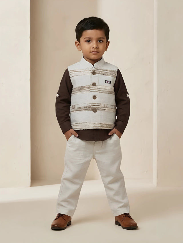 Boys brown full sleeve shirt with a cream textured printed waistcoat and matching cream trousers