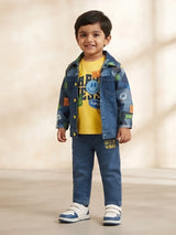 Young boy wearing a blue printed full sleeve denim jacket over a yellow graphic t-shirt and matching blue jeans