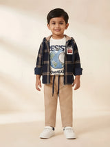 Boys wearing a black plaid hooded jacket layered over a graphic t-shirt with beige trousers