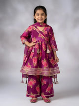 Young girl wearing a purple floral printed angrakha sharara set with gota border and tassels