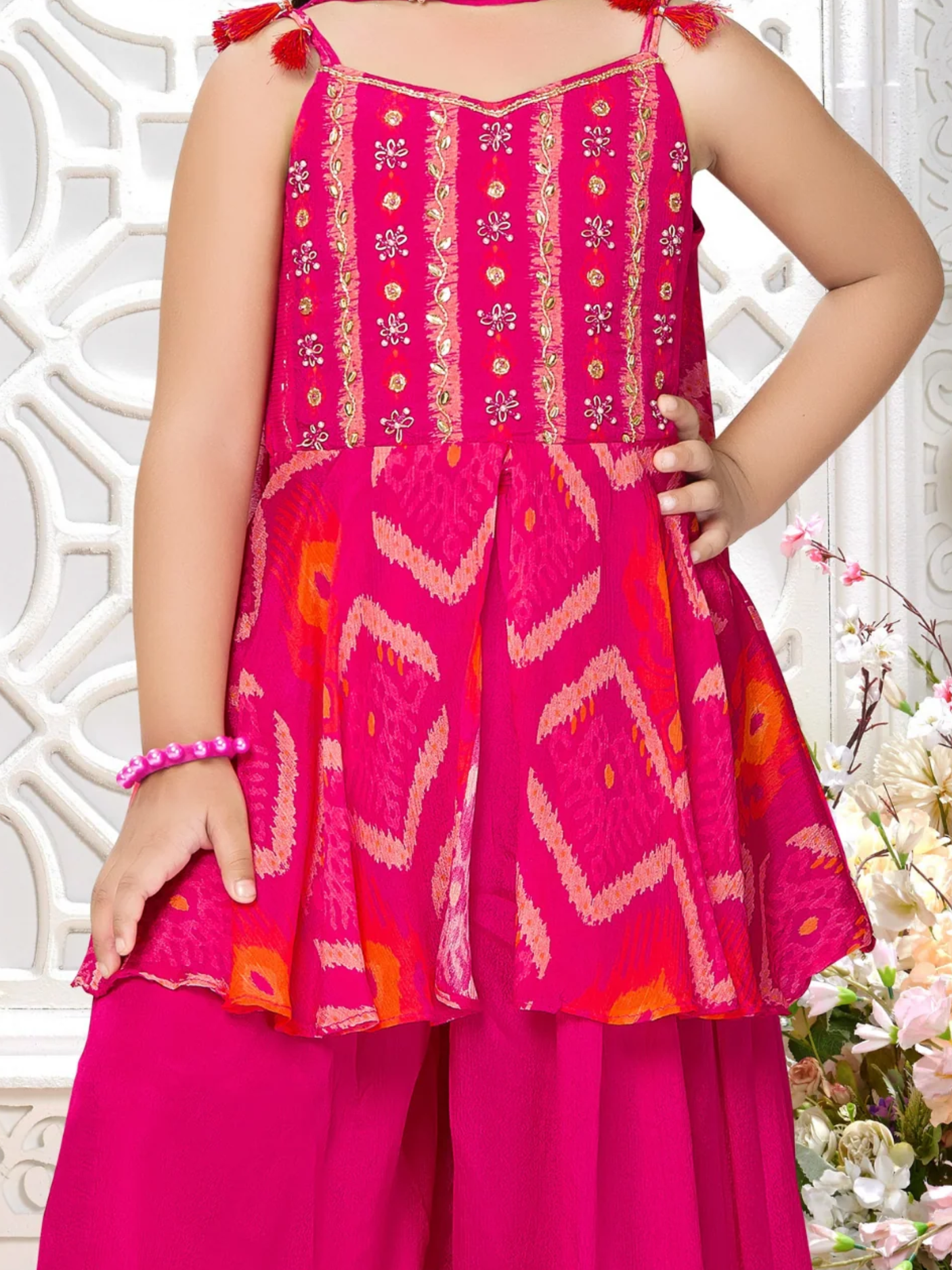 Girls' Vibrant Rani Pink Sharara Suit with Embroidered Peplum Top.