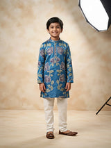Boys wearing a blue floral printed full sleeve kurta with off-white trousers