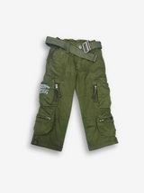 Boys' dark olive green cargo pants with many zippered side pockets, a matching web belt, and cuffed or slightly cropped leg openings.

Export to Sheets