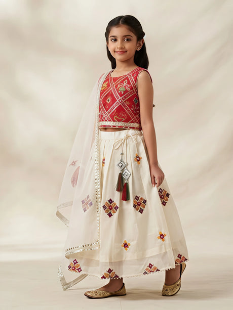 Red sleeveless top and white layered skirt set for girls.