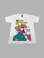 White short-sleeve kids' T-shirt with a retro Pink Panther graphic print wearing yellow sunglasses and a blue Hawaiian shirt. The comic-style design includes the title "PINK PANTHER" and "THE PANTHER GOES HOLLYWOOD!".