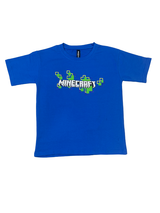 Royal Blue boys' short-sleeve T-shirt with the white Minecraft logo and a scattered pattern of green and yellow pixelated blocks graphic printed centrally