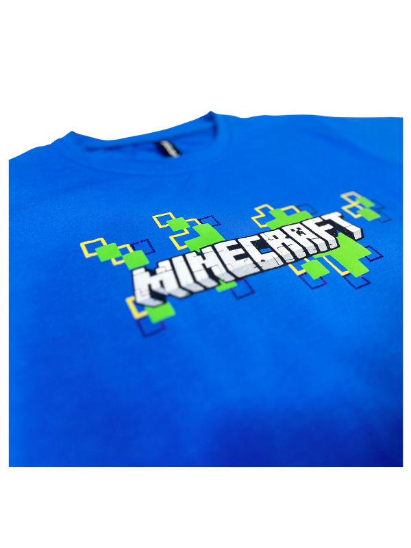 Royal Blue boys' short-sleeve T-shirt with the white Minecraft logo and a scattered pattern of green and yellow pixelated blocks graphic printed centrally