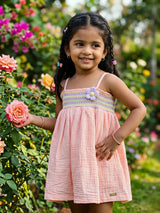 Smocked Peach Cotton Frock with Purple Floral Accent