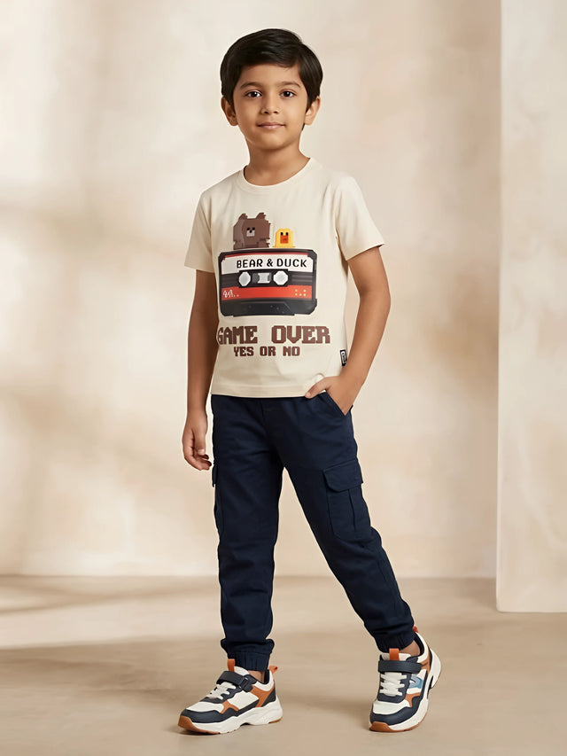 Cream boys t-shirt with pixel art bear and duck cassette graphic print.