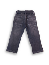 Boys' dark grey/black wash denim jeans with a slightly faded look, an elastic waist, and a thick black web belt with a rectangular silver buckle.

Export to Sheets