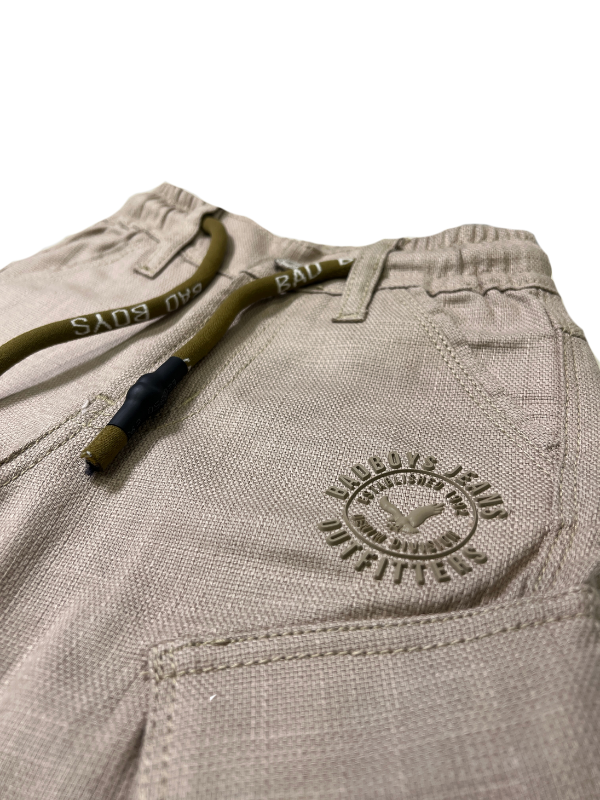 Boys' dark grey wash denim-look pants with an elastic waist, straight leg, and a thick khaki or tan-colored web belt with a silver rectangular buckle.