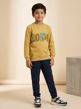 Yellow graphic print t-shirt for boys with colorful lettering and paint splatter details