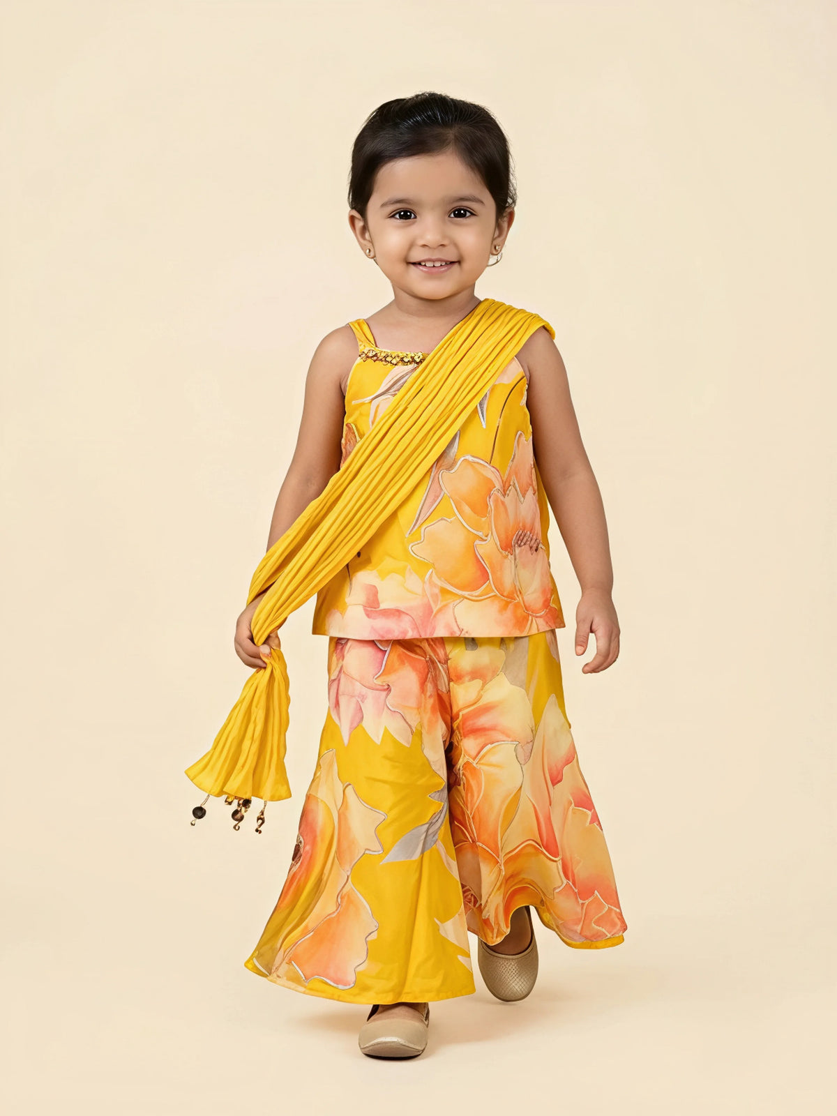 Yellow floral print sharara set for girls with matching dupatta displayed on a white background