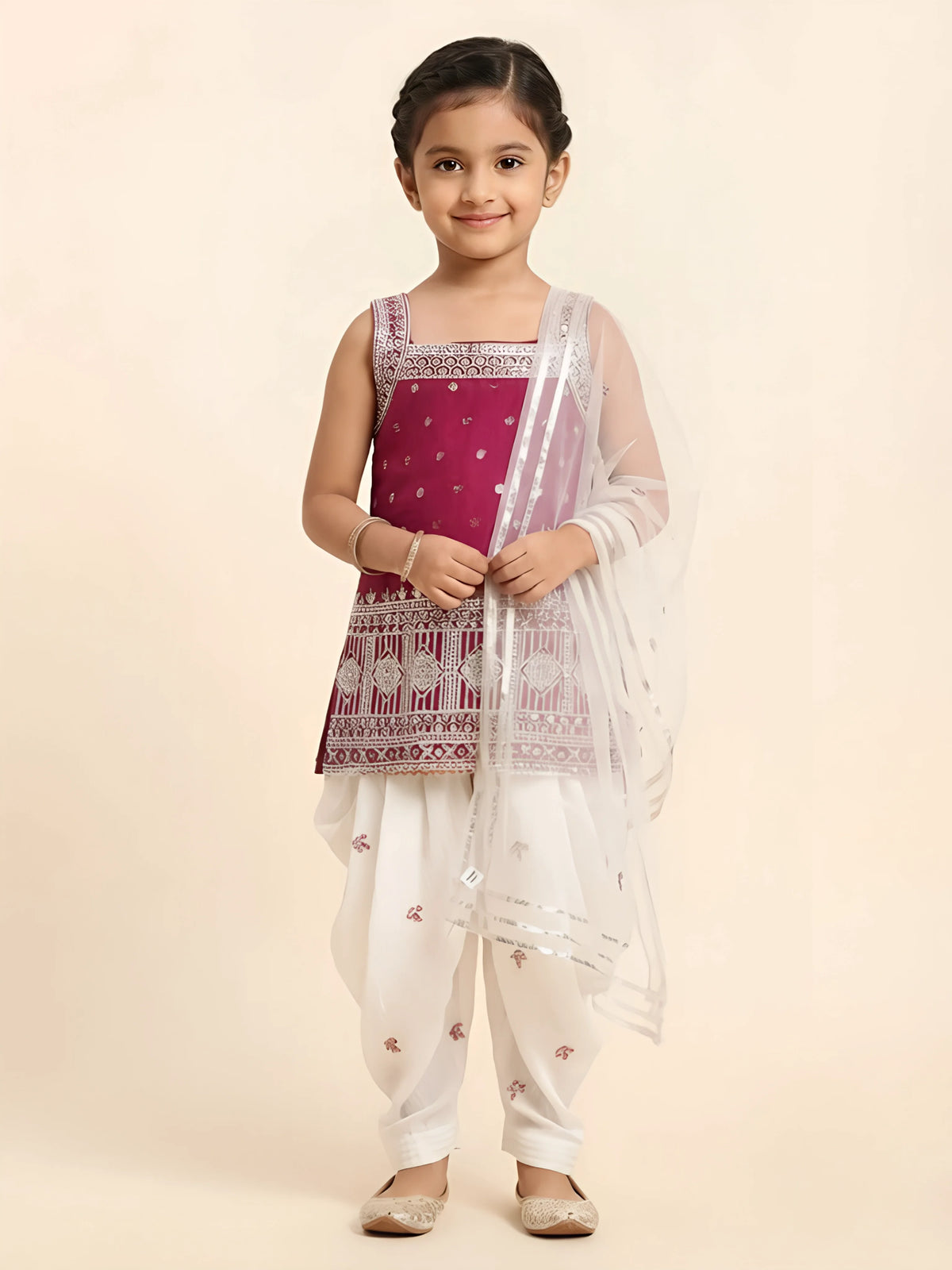 Girls Rani pink printed sleeveless kurta with white dhoti pants and dupatta set.