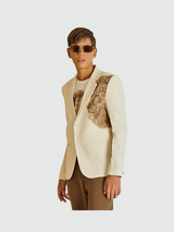 Cream/off-white boys' two-button blazer with a notch lapel and a prominent textured brown lion head graphic on the chest