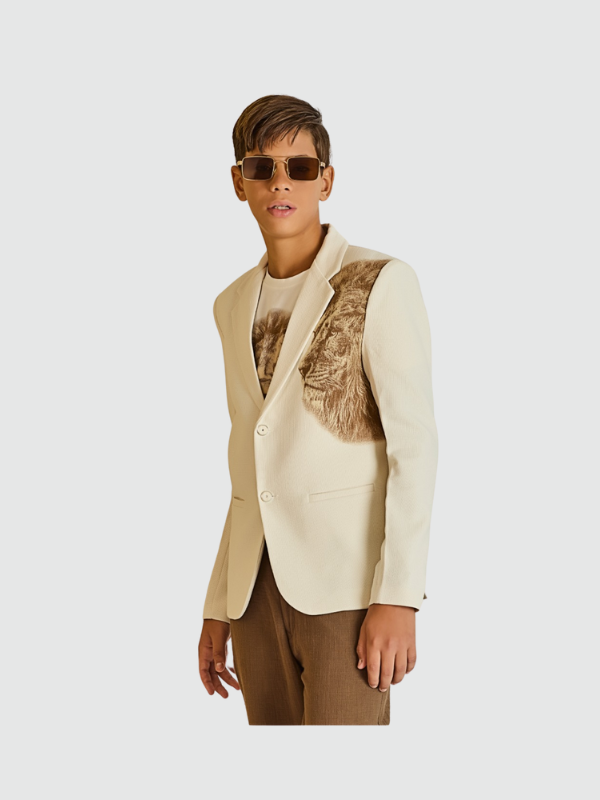 Cream/off-white boys' two-button blazer with a notch lapel and a prominent textured brown lion head graphic on the chest