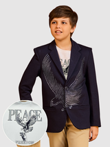 Young boy wearing a navy blue blazer with a large, silvery/gray eagle wing graphic on the chest, styled over a white 'Peace Freedom' graphic t-shirt.