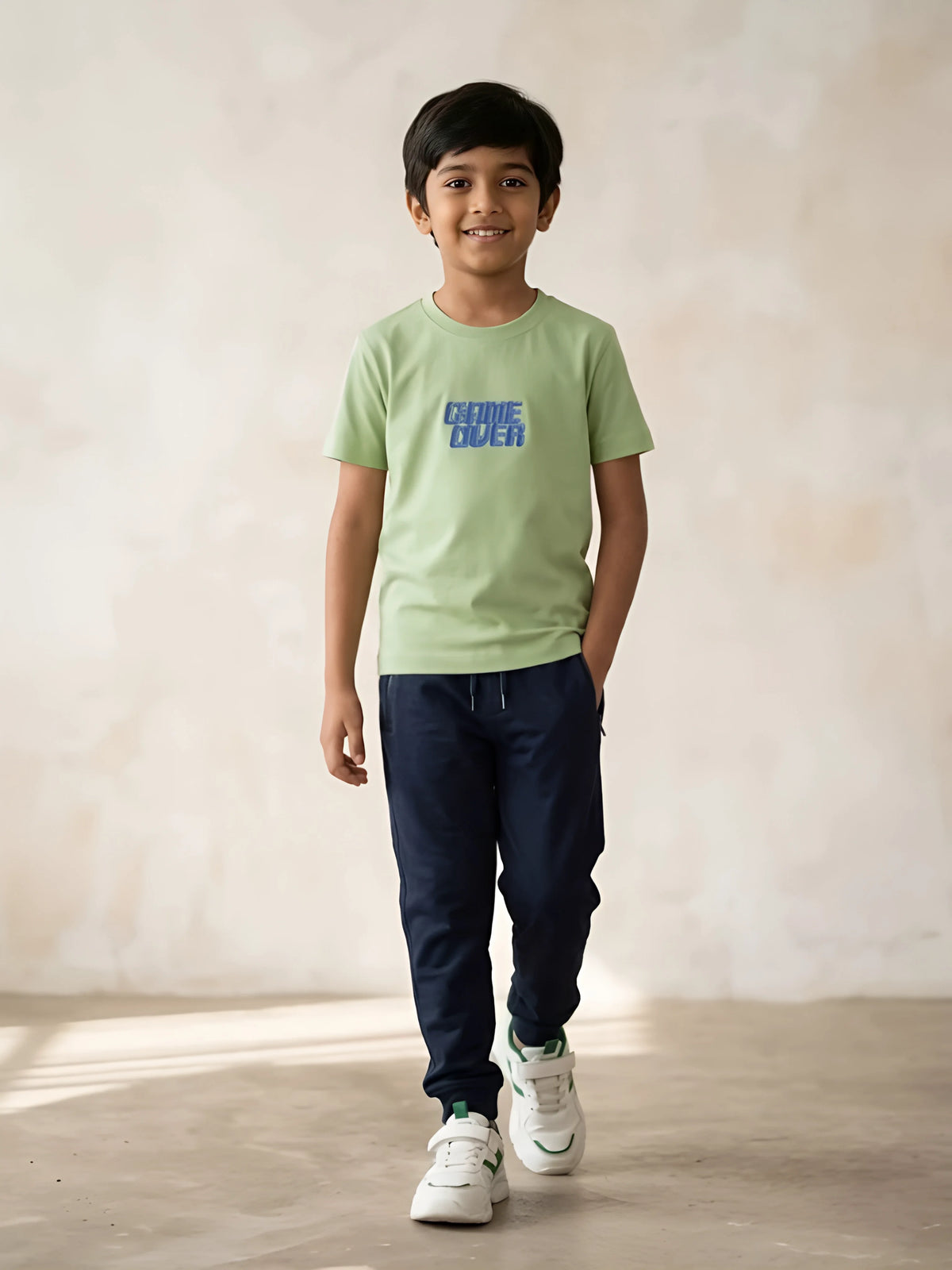 Boys green graphic printed round neck short sleeve t-shirt with text design.