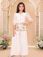 Young girl modeling a cream/off-white ethnic set with a three-quarter sleeve top, multi-colored floral embroidery, and wide-leg palazzo pants.