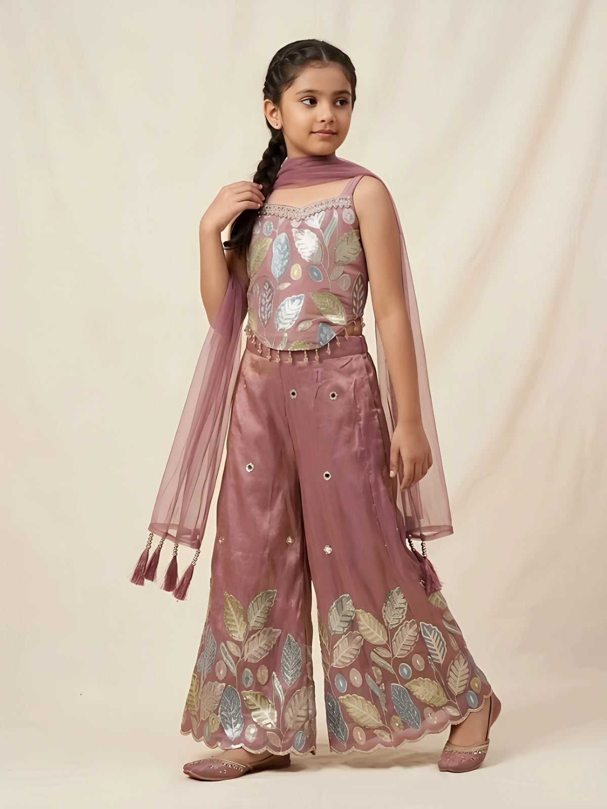 Shop stylish girls purple embroidered palazzo set featuring leaf embroidery, mirror work pants, and tassel dupatta for festive occasions.