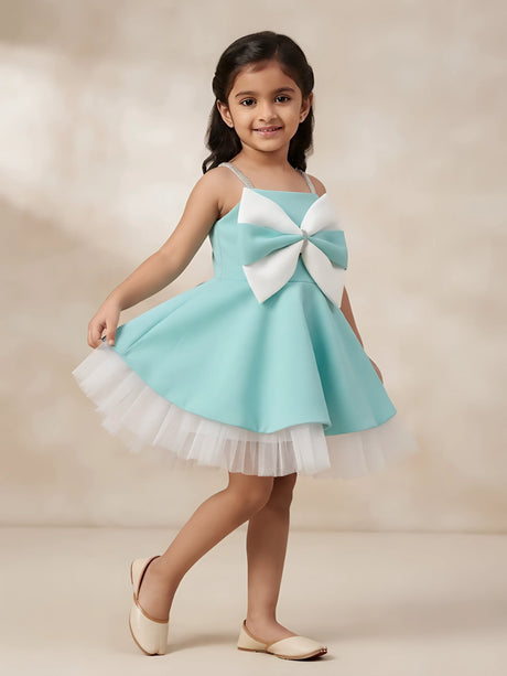 Green bow detailed party wear frocks for girls with a layered white tulle skirt.
