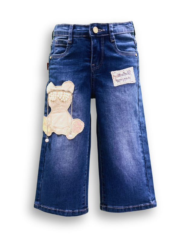 Girls' medium blue wash wide-leg denim jeans with an embroidered teddy bear patch decorated with pearls on the left leg, and a lace patch on the right.

Export to Sheets