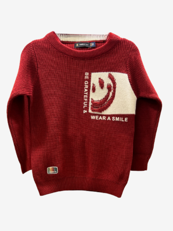 Maroon/Burgundy boys' long-sleeve knit sweater with a ribbed texture, featuring a white contrast panel with a red knitted smiley face and the text "BE GRATEFUL & WEAR A SMILE.