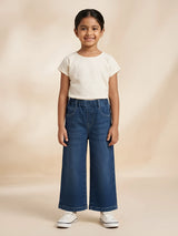 Young girl wearing navy blue wide leg casual pants with front pockets and elastic waistband