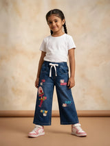 Young girl wearing navy blue graphic print casual pants with white drawstring and pockets