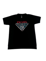 Black boys' matching coordinate set, including a short-sleeve T-shirt with a large metallic triangle logo and black shorts with a white logo graphic and drawstring