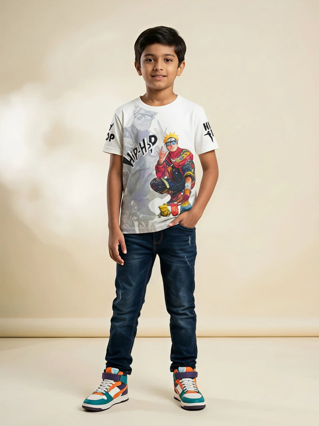 Young boy wearing a white short sleeve crew neck t-shirt with a colorful anime hip-hop graphic print paired with dark blue jeans