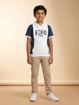 Young boy wearing a white and blue colorblock hooded short sleeve casual t-shirt with ECHO print and front kangaroo pocket